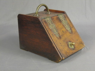 A Victorian walnut coal box with brass banding