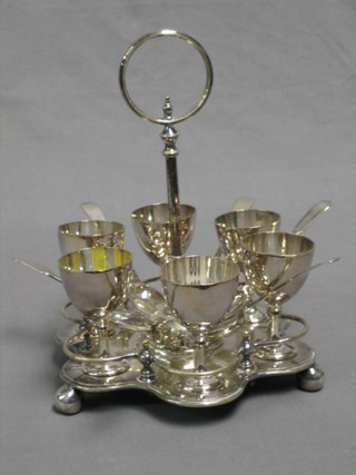 A silver plated 6 piece egg cruet complete with fiddle pattern spoons