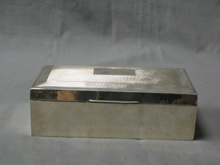 A silver cigarette box with hinged lid, Birmingham 1925 (marks rubbed) 6 1/2"