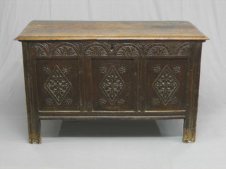 A 17th/18th Century carved oak coffer of panelled construction with hinged lid 48" (crude screw repair to lid)