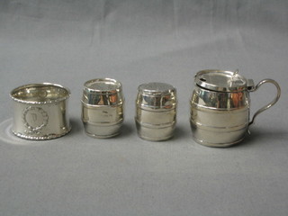 A circular 3 piece silver condiment set in the form of barrels comprising mustard pot, pepper and salt pot, Birmingham 1939 together with a waisted silver napkin ring