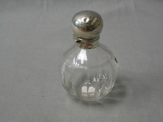 An Art Deco  globular cut glass scent bottle with silver lid