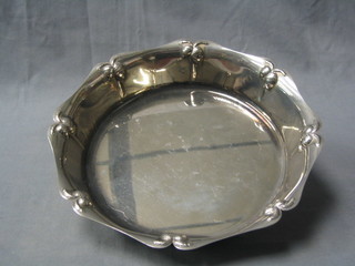 A circular silver plated nut dish decorated acorns 9 1/2"