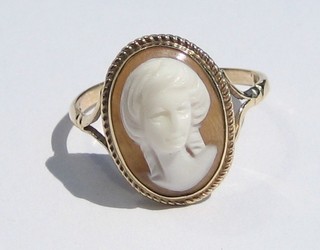 A lady's 9ct gold dress ring set an oval shell carved cameo portrait