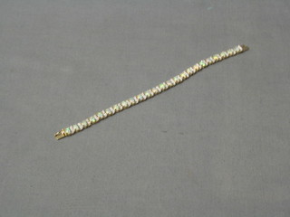 A simulated opal and diamond bracelet