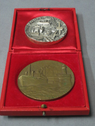 A Belgian bronze medallion presented to T.M. Free Enterprise III 4000th ship arriving at Bruges-Zeebrugge together with a silver coloured medallion presented by The Institute of Marine Chambers of Commerce Calais