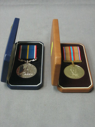 A pair to 3106688 A C Laurence National Service medal and Suez medal, boxed