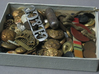 A small collection of old buttons, collar dogs, a medal ribbon, a brass ring with shield etc