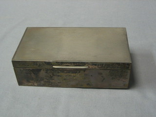 A silver engraved cigarette box with engine turned decoration and hinged lid Birmingham 1944 6 1/2"