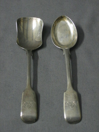 An Edwardian silver fiddle pattern jam spoon, London 1900 together with an Edwardian silver fiddle pattern caddy spoon, London 1906