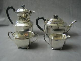 A 4 piece Georgian style silver plated tea service comprising oval teapot, twin handled sugar basin, cream jug and hotwater jug