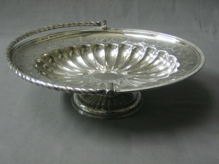 An oval embossed silver plated cake basket with swing handle 11"