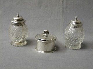 A Victorian silver mustard pot with hinged lid (f) marks rubbed and 2 cut glass condiment jars with silver lids (1 cracked)