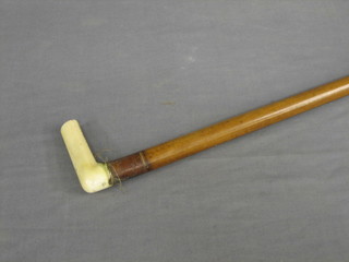 An Edwardian melacca walking cane with ivory handle