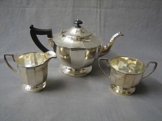 An Art Deco circular shaped 3 piece silver plated tea service comprising teapot, twin handled sugar bowl and cream jug