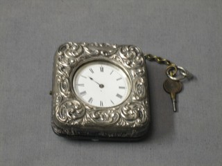 A Victorian open faced fob watch contained in a silver pair case by J Stockhall of London (f), contained within an Edwardian embossed silver travelling case, Birmingham 1901