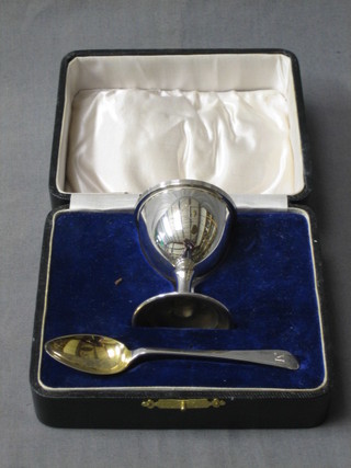 A silver egg cup and spoon, monogrammed A, Birmingham 1925, cased