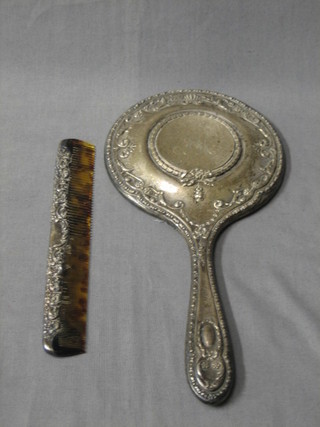 An Edwardian embossed silver hand mirror and matching comb Birmingham 1906