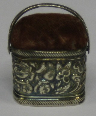 A miniature "silver" pin cushion in the form of a basket decorated thistles etc