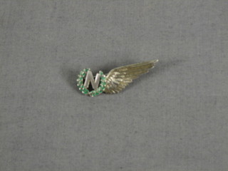 A silver and enamel RAF sweetheart's brooch in the form of a navigator's half wing