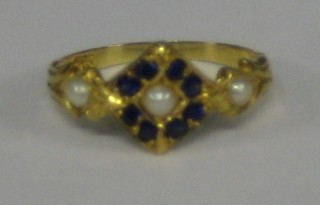 A lady's 18ct yellow gold dress ring set 8 sapphires and 3 pearls