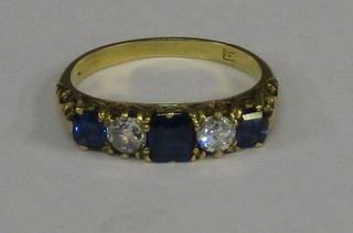 A lady's 18ct yellow gold dress ring set 3 sapphires surrounded by diamonds