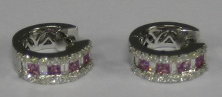 A pair of lady's 18ct white gold hoop earrings set 4 square cut sapphires and numerous diamonds