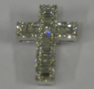 A lady's 18ct white gold cross pendant set numerous baguette cut diamonds (approx 0.82ct)