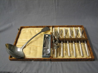 A silver plated Old English pattern soup ladle, a set of 6 fish knives and forks and a small collection of flatware
