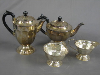 An Art Deco 3 piece circular silver plated tea service with teapot, hot water jug and cream jug