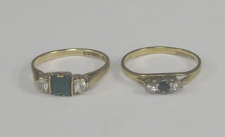 A lady's 9ct gold dress ring set green and white stones and 9ct gold dress ring set black and white stones