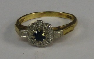 A A lady's 18ct gold dress ring with illusion set sapphire and diamonds