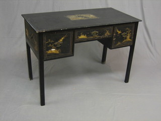 A 1930's Oriental black lacquered writing table, fitted 1 long drawer flanked by 2 short drawers, raised on square supports 41"