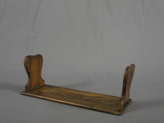 A pair of carved olive wood expanding book ends 15"