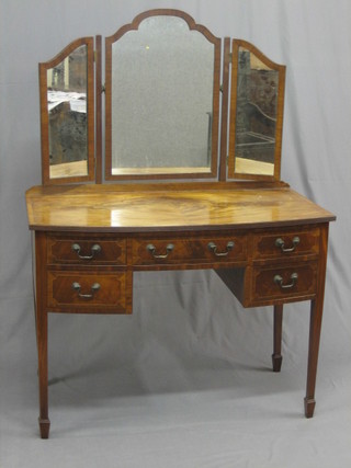 A handsome Edwardian Georgian style inlaid mahogany bow front dressing table with triple mirrors over, the base fitted 1 long and 2 short drawers with brass swan neck drop handles, raised on square tapering supports ending in spade feet 41"