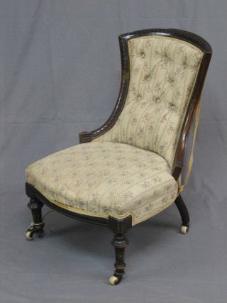 A Victorian carved walnut show frame nursing chair upholstered in Regency stripe