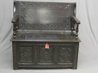 A 19th/20th Century dark carved oak monks bench 39"