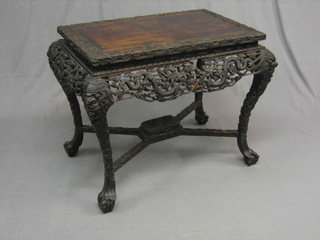 A 19th Century Eastern carved and pierced hardwood rectangular occasional table, raised on cabriole claw and ball supports united by an X framed stretcher 33" (some damage to the frieze)