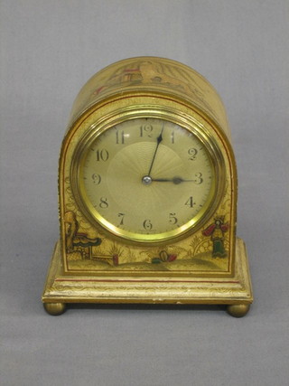 A 1930's French 8 day mantel clock with silvered dial contained in an arched yellow lacquered case with chinoiserie decoration