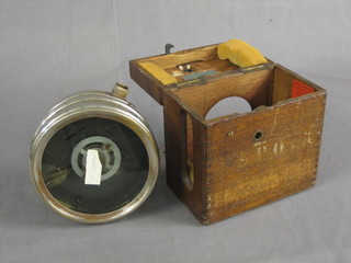 A Boddy & Riggwood circular racing pigeon clock 7" contained in an oak carrying case