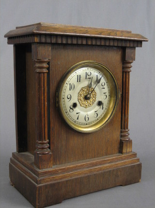 A 19th Century German striking bracket clock with silvered dial and Arabic numerals contained in a carved oak case by HAC