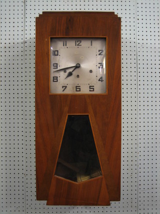 A French Art Deco 8 day chiming wall clock with square silvered dial and Arabic numerals contained  in a walnut case