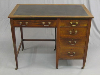 An Edwardian inlaid mahogany pedestal typists desk with inset tooled leather writing surface above 1 long and 4 short drawers 36"