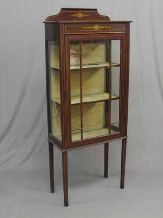 An Edwardian simulated inlaid mahogany display cabinet, the interior fitted shelves enclosed by an astragal glazed panelled door, raised on square tapering supports 23 1/2"
