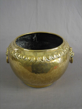A circular brass jardiniere with lion mask handles 15"