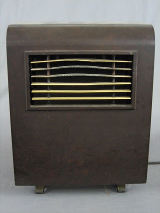 A Thermovent electric fire contained in a brown Bakelite case