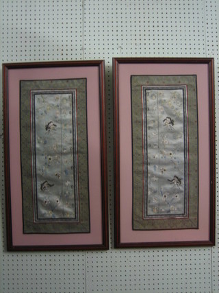 A pair of Oriental embroidered panels depicting butterflies amidst branches 24" x 10"