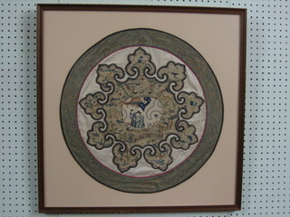 A Chinese circular embroidered panel depicting figures, framed and the reverse marked These are real Chinese embroideries removed from Priest robes, dated 1971, 19"