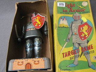 A Japanese battery operated tin plate figure of a Knight in Armour, boxed