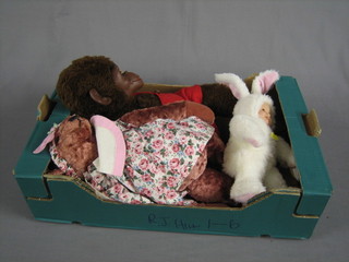 A cuddly figure of a monkey, do. pink teddybear with growl and a figure of a rabbit